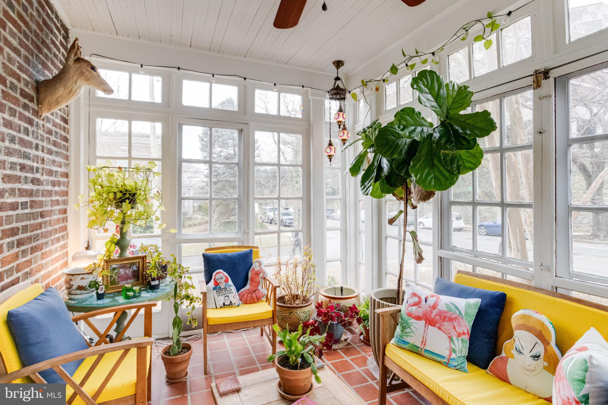 3901 Keswick Road Baltimore, MD 21211 - Photo 17 of 87 a living room filled with furniture and floor to ceiling windows