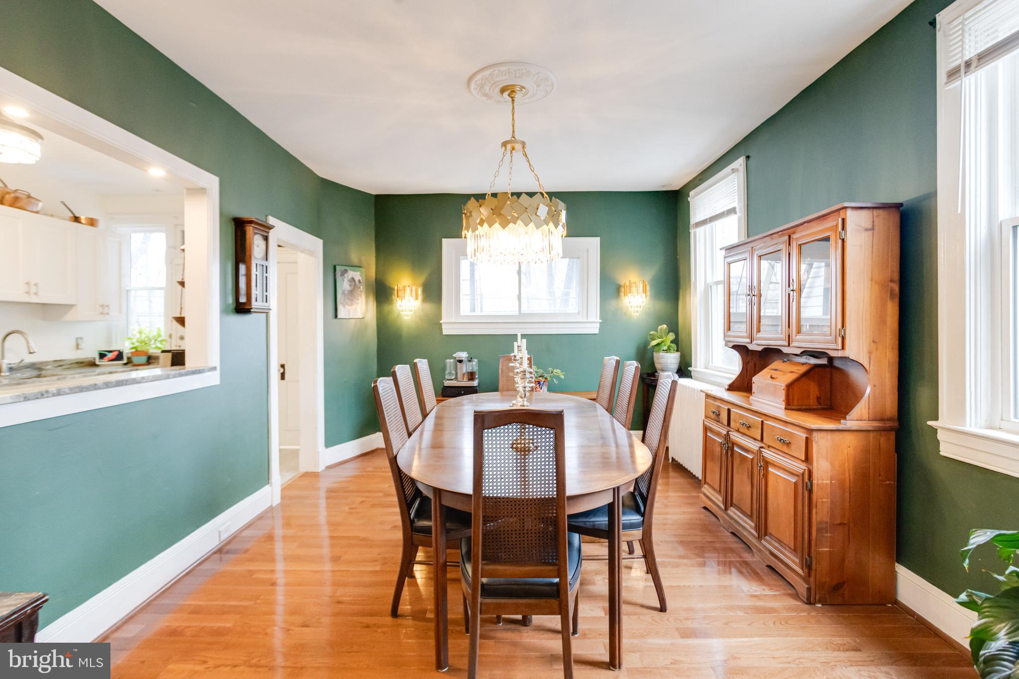 3901 Keswick Road Baltimore, MD 21211 - Photo 20 of 87 a dining room with furniture a window and wooden floor