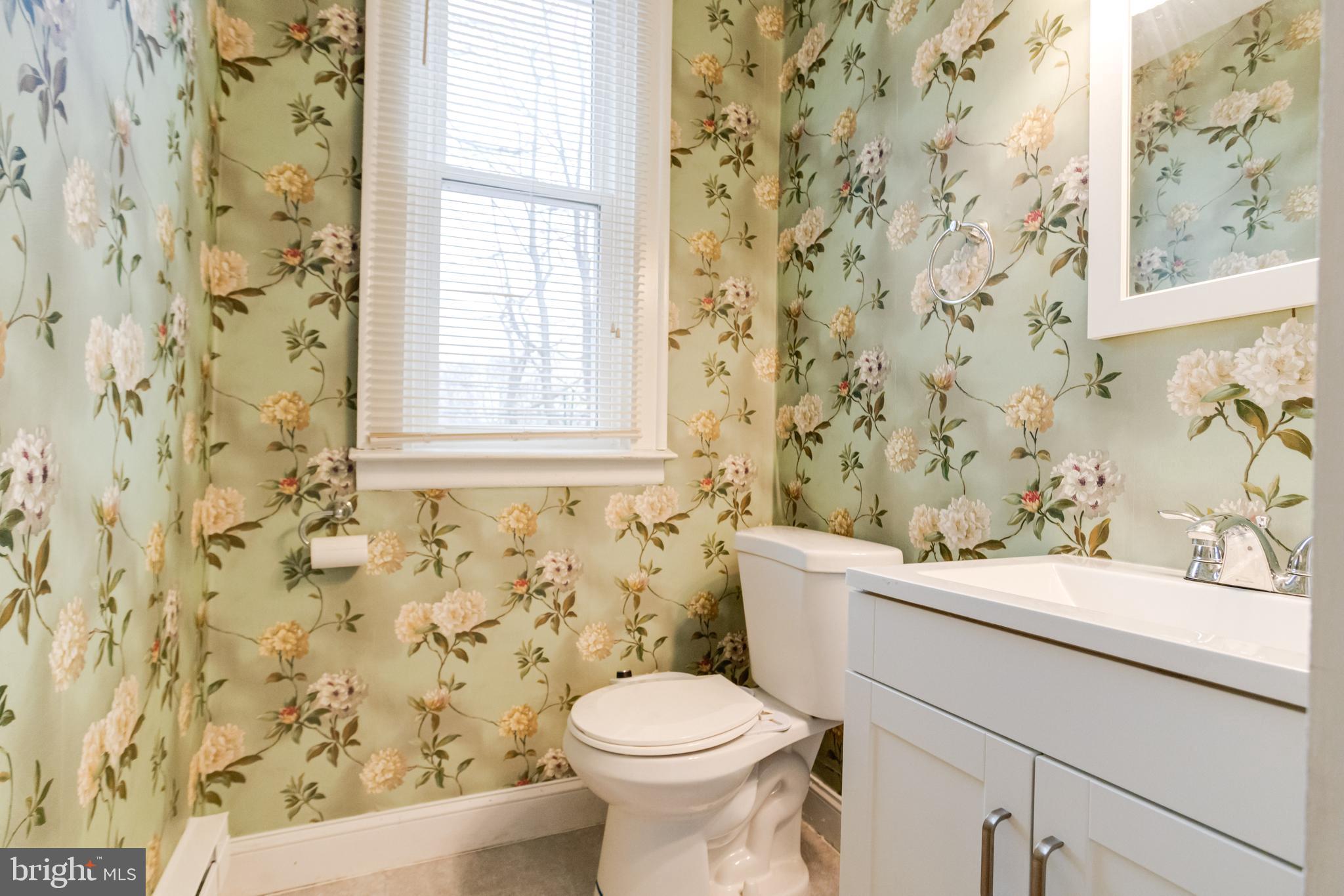 3901 Keswick Road Baltimore, MD 21211 - Photo 34 of 87 a bathroom with a sink and a toilet