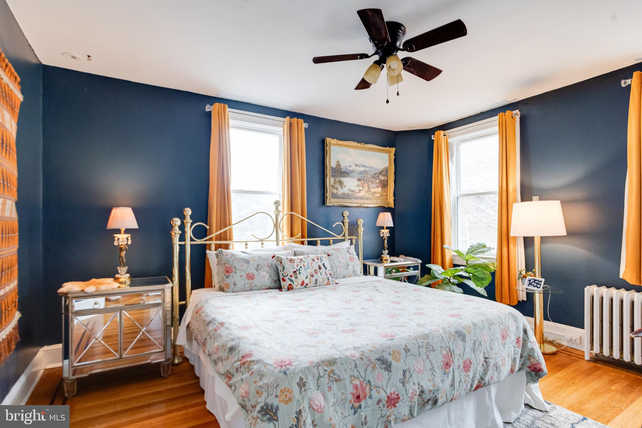 3901 Keswick Road Baltimore, MD 21211 - Photo 43 of 87 a bedroom with a bed and a chandelier