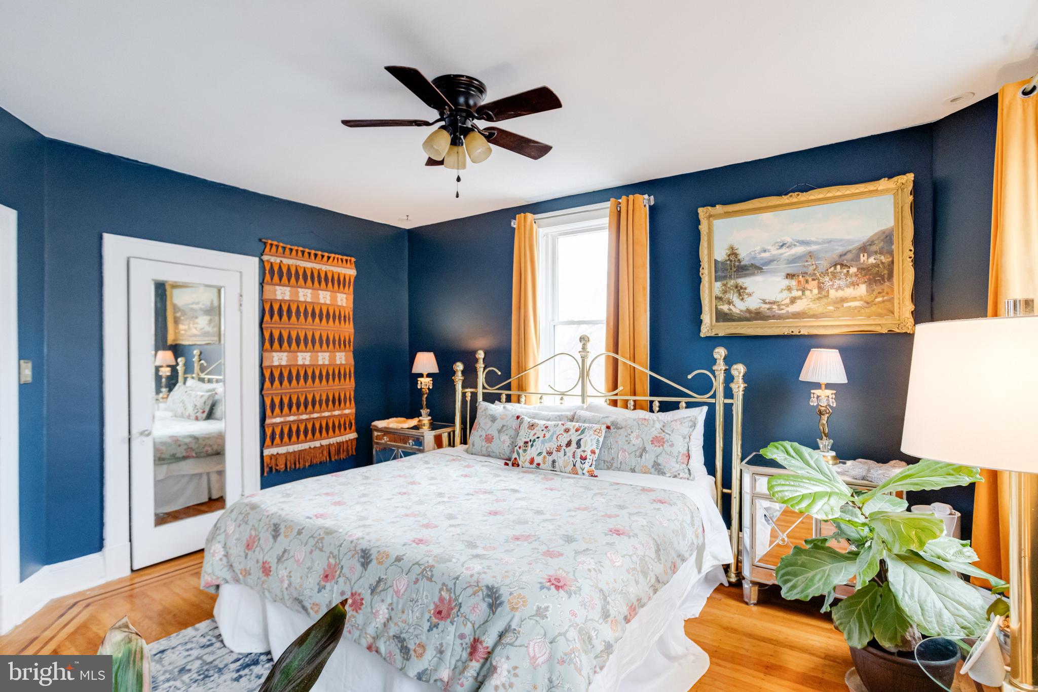 3901 Keswick Road Baltimore, MD 21211 - Photo 50 of 87 a bedroom with a bed and a chandelier