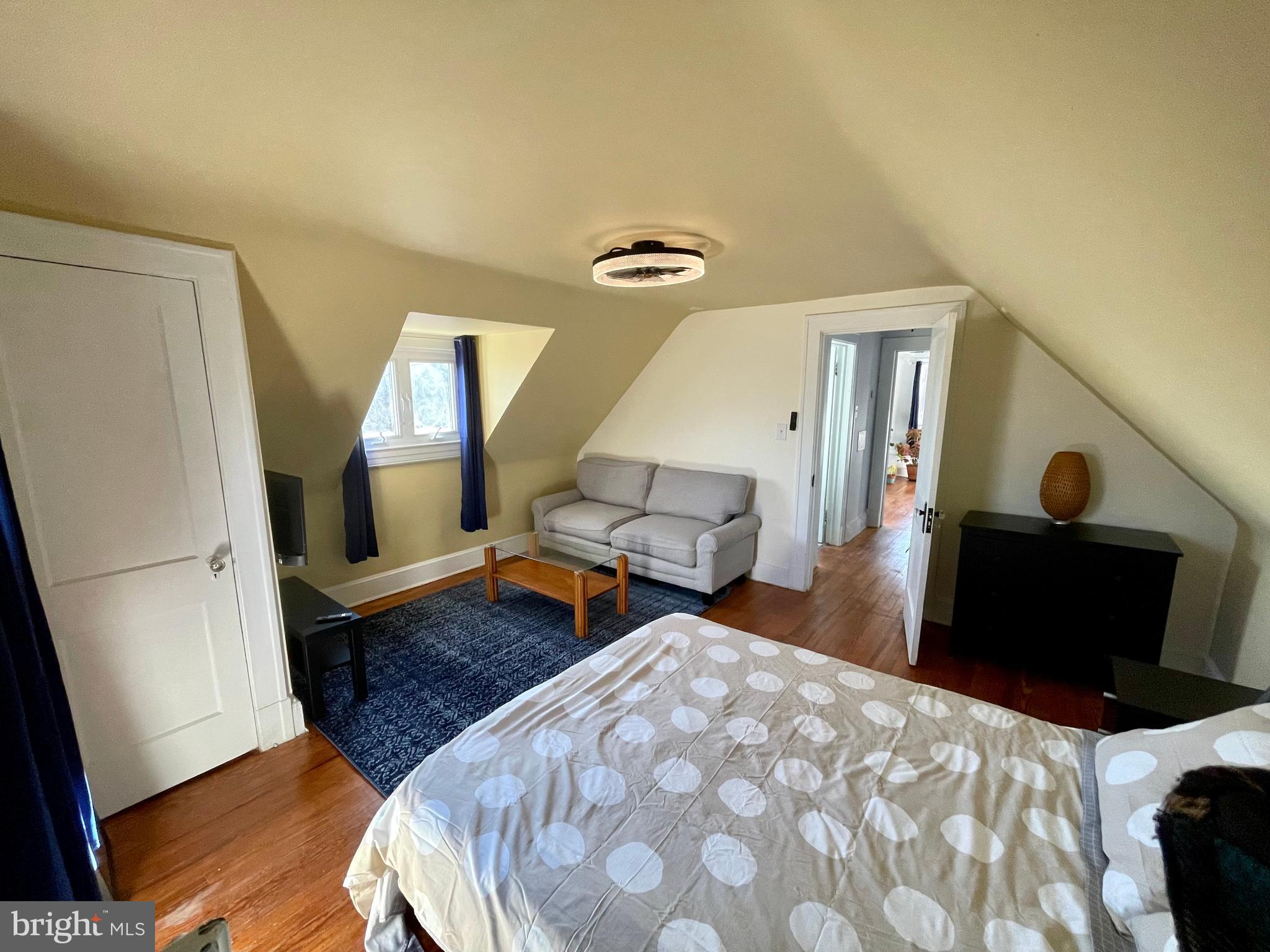 3901 Keswick Road Baltimore, MD 21211 - Photo 60 of 87 a bedroom with bed and wooden floor