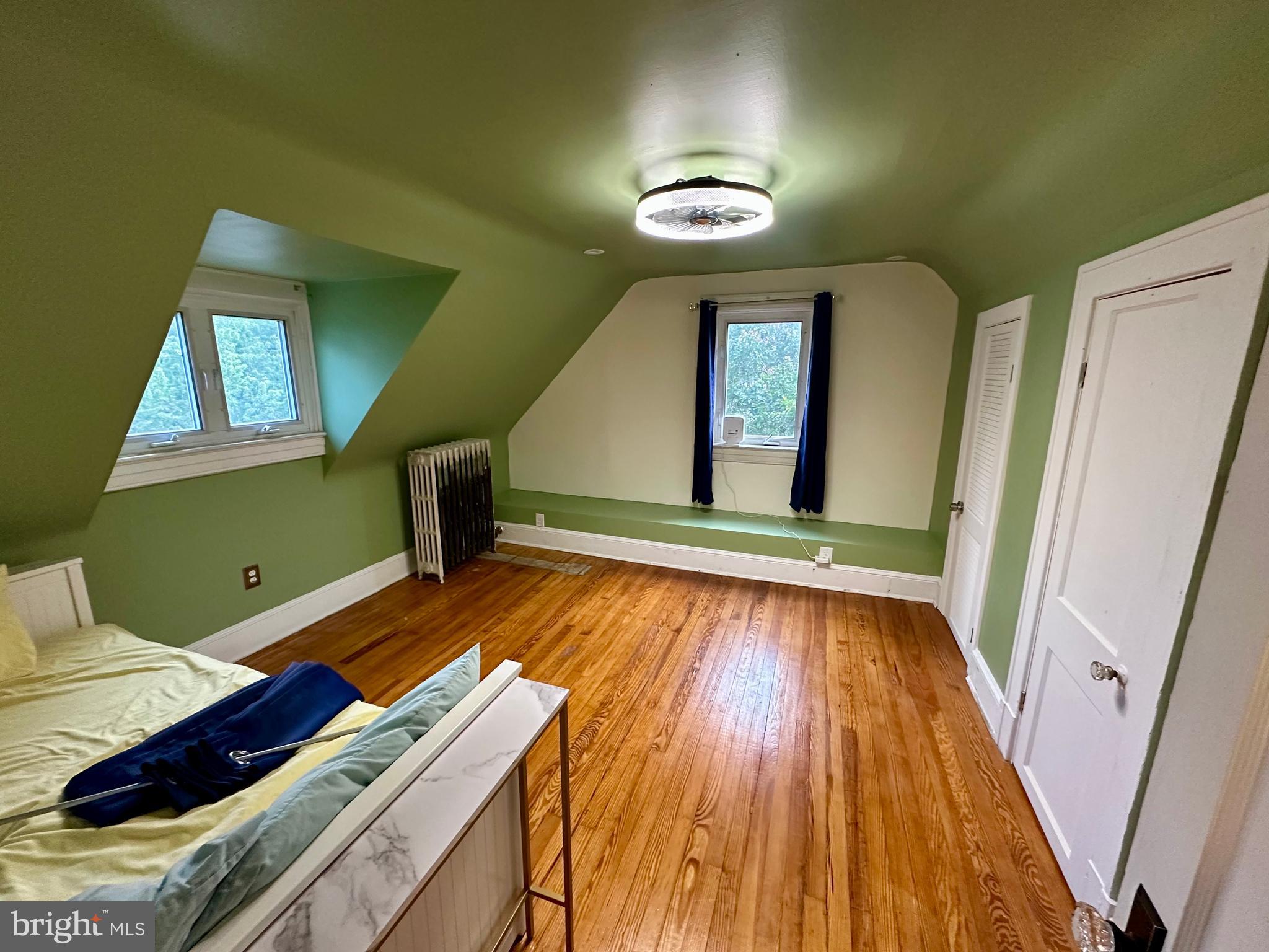 3901 Keswick Road Baltimore, MD 21211 - Photo 65 of 87 a view of a room with wooden floor and staircase