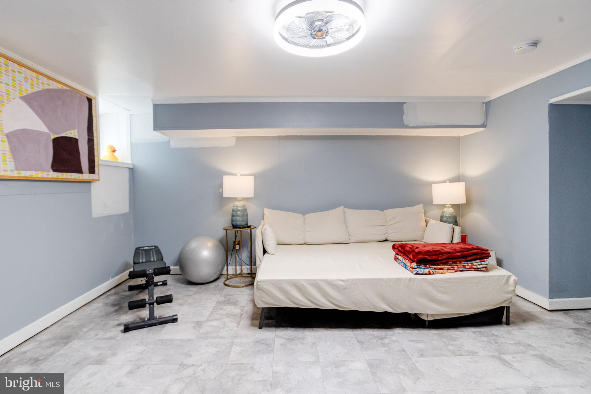 3901 Keswick Road Baltimore, MD 21211 - Photo 69 of 87 a bedroom with a bed and a lamp