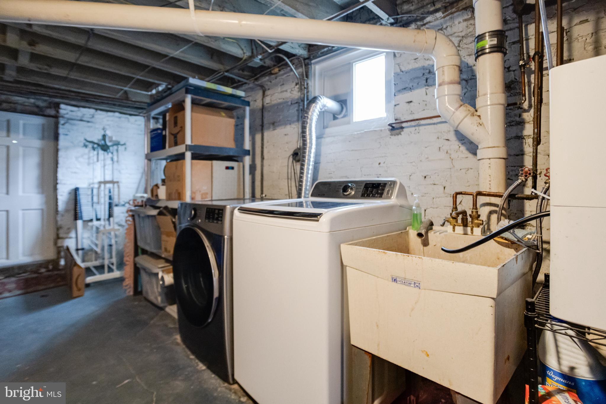 3901 Keswick Road Baltimore, MD 21211 - Photo 73 of 87 a utility room with dryer and washer
