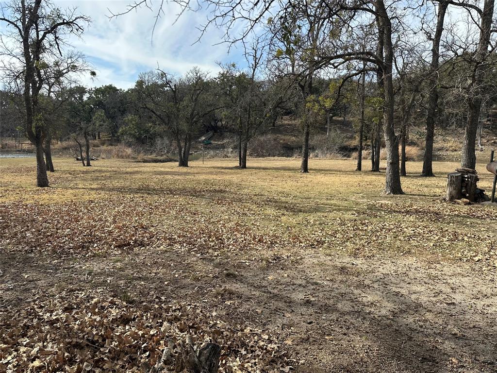 Lot 632 Lakeside Drive May, TX 76857 - Photo 5 of 9 a view of a yard with trees