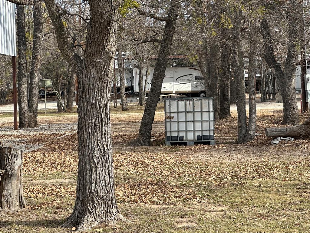 Lot 632 Lakeside Drive May, TX 76857 - Photo 8 of 9 a front view of a house with a yard