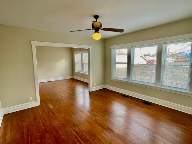a view of an entryway with wooden floor and a window