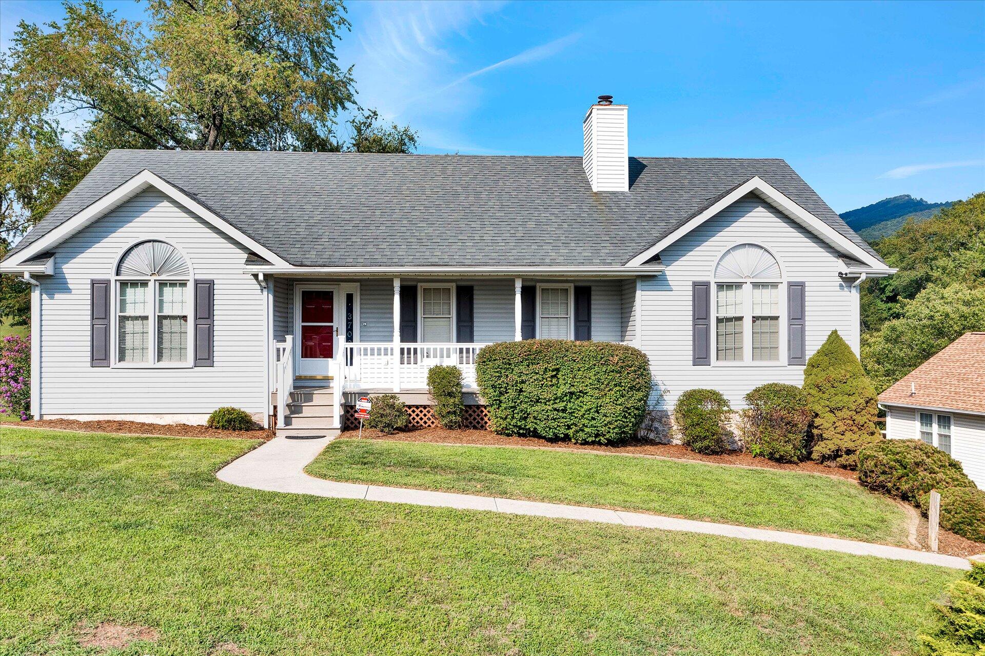 3700 Rte 3004 Roanoke, VA 24012 - Photo 2 of 40 a front view of a house with a garden and plants
