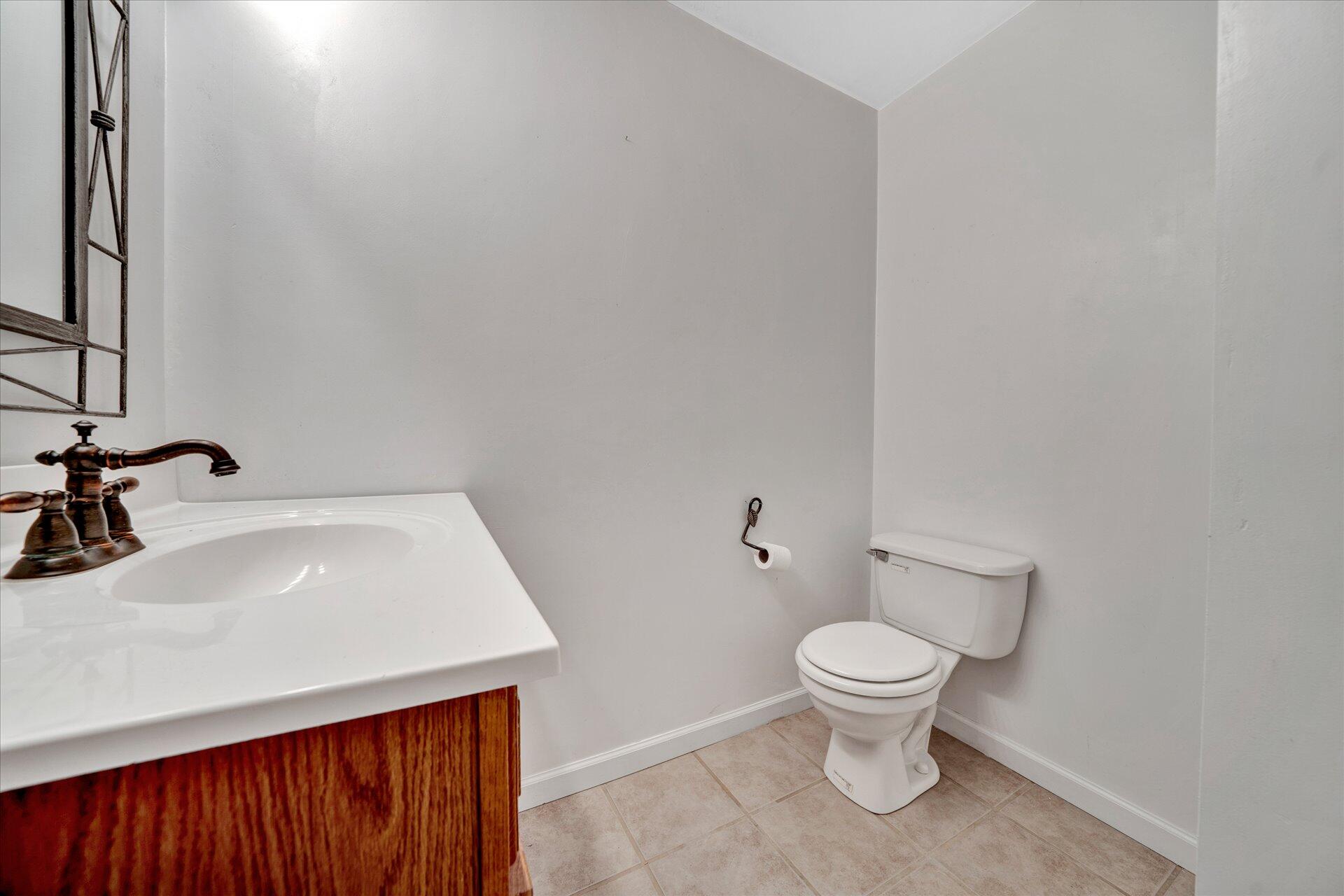 3700 Rte 3004 Roanoke, VA 24012 - Photo 27 of 40 a bathroom with a sink a toilet and a mirror