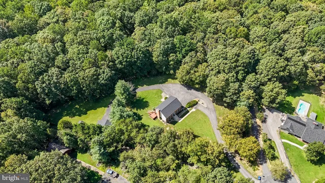 a kitchen with granite countertop a sink and cabinets