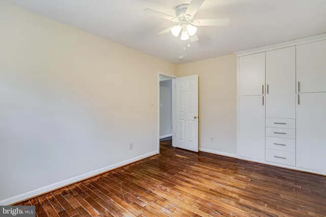an aerial view of a house with yard and swimming pool