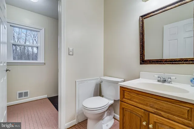 a view of a balcony with wooden floor and fence