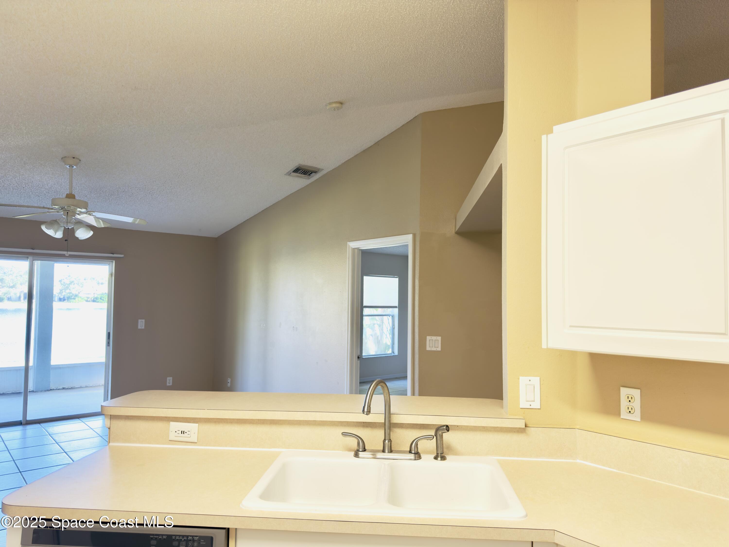 4691 Manchester Drive Rockledge, FL 32955 - Photo 4 of 6 a bathroom with a tub and a sink
