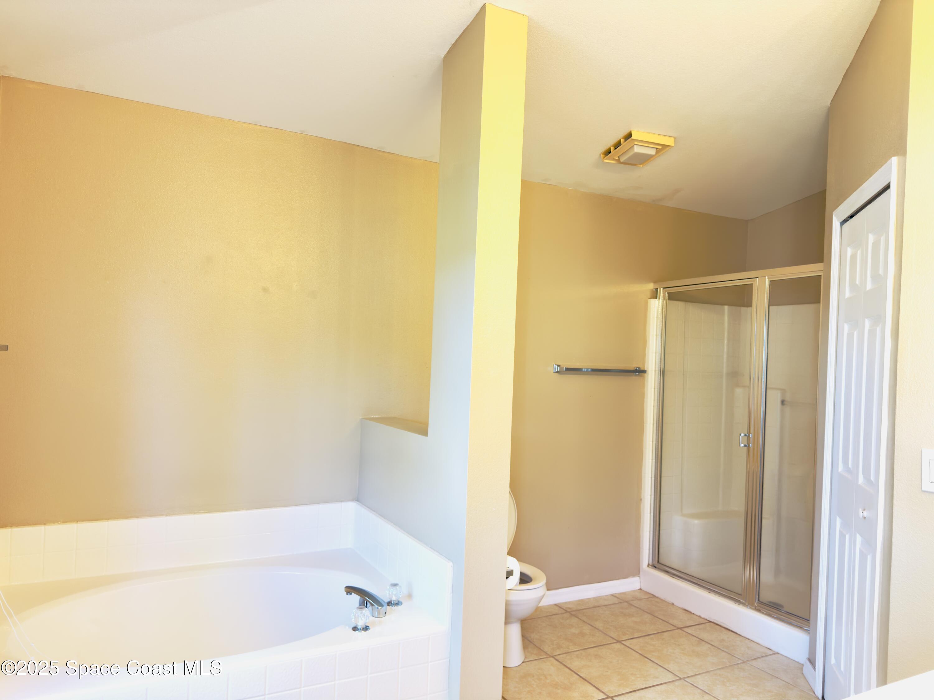 4691 Manchester Drive Rockledge, FL 32955 - Photo 5 of 6 a bathroom with a bathtub