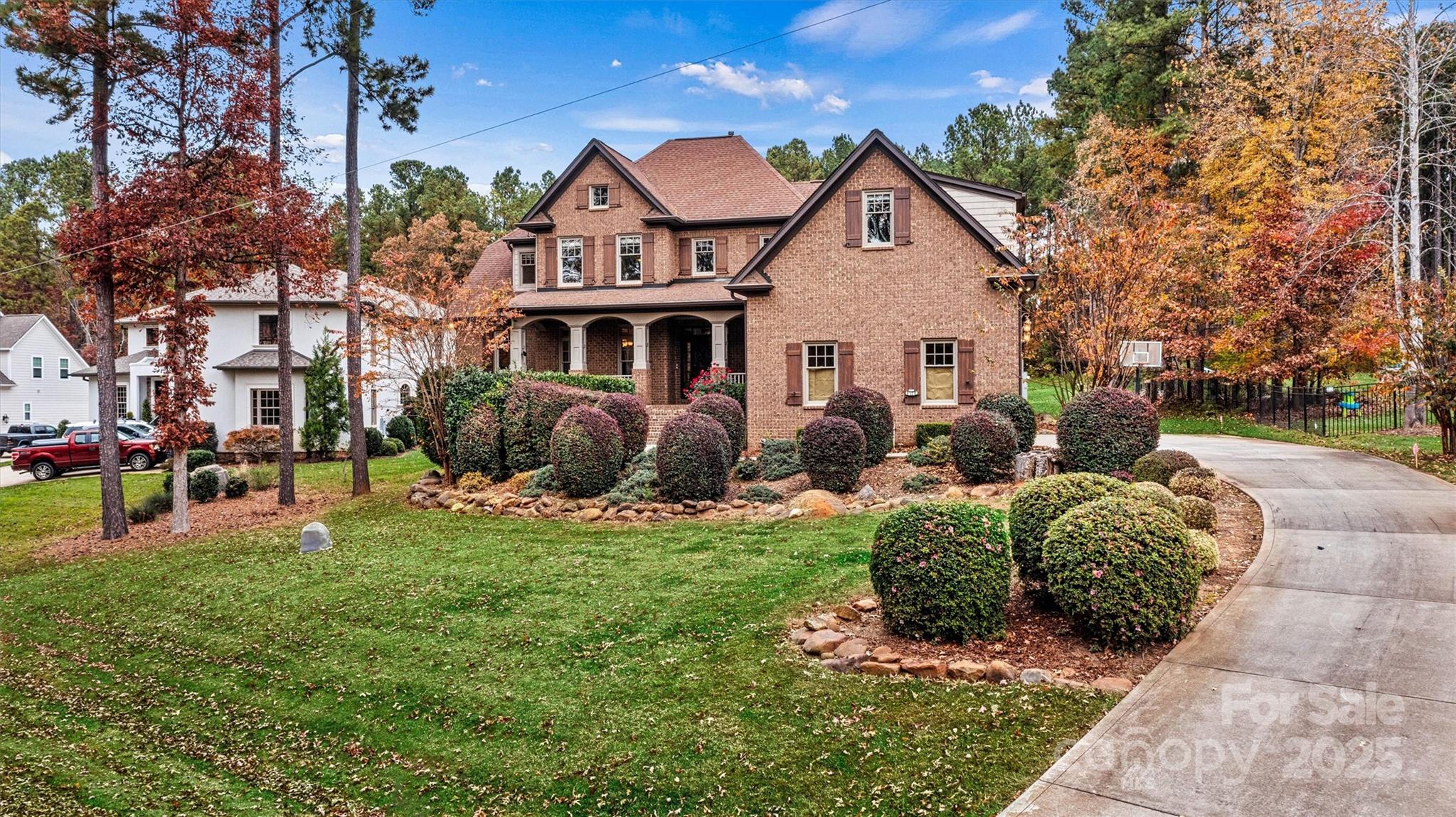 a front view of house with yard and green space