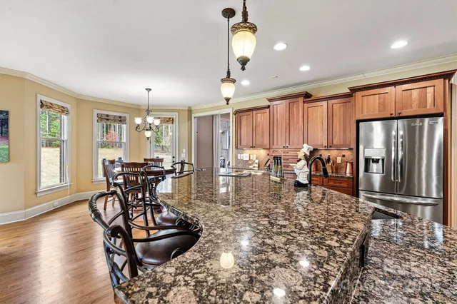 a room with lots of chairs and mirrors