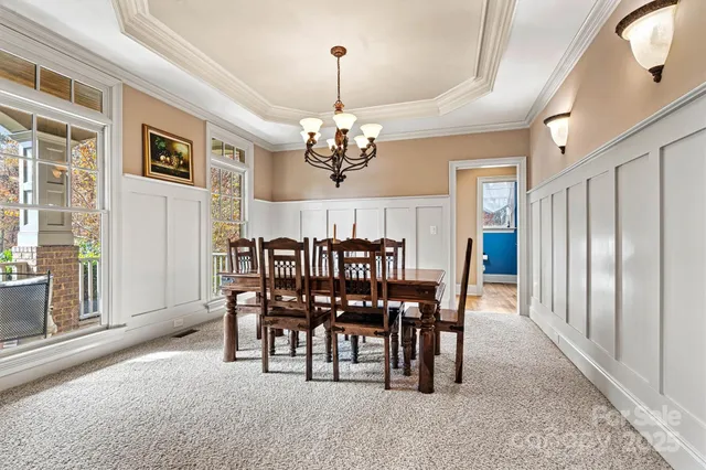 a view of a dining room with furniture and window