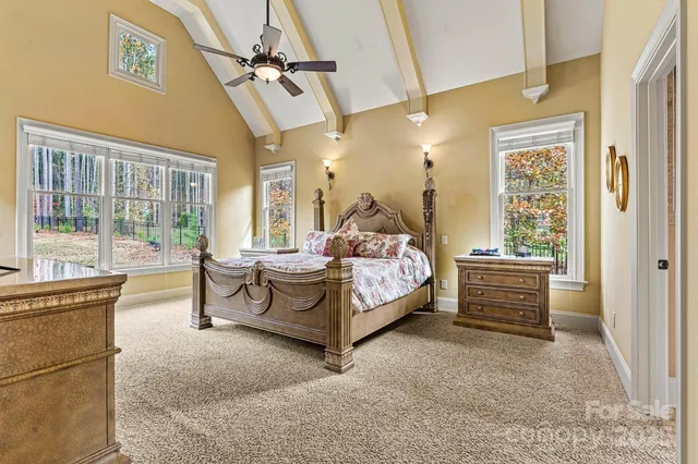 a bedroom with furniture and a window