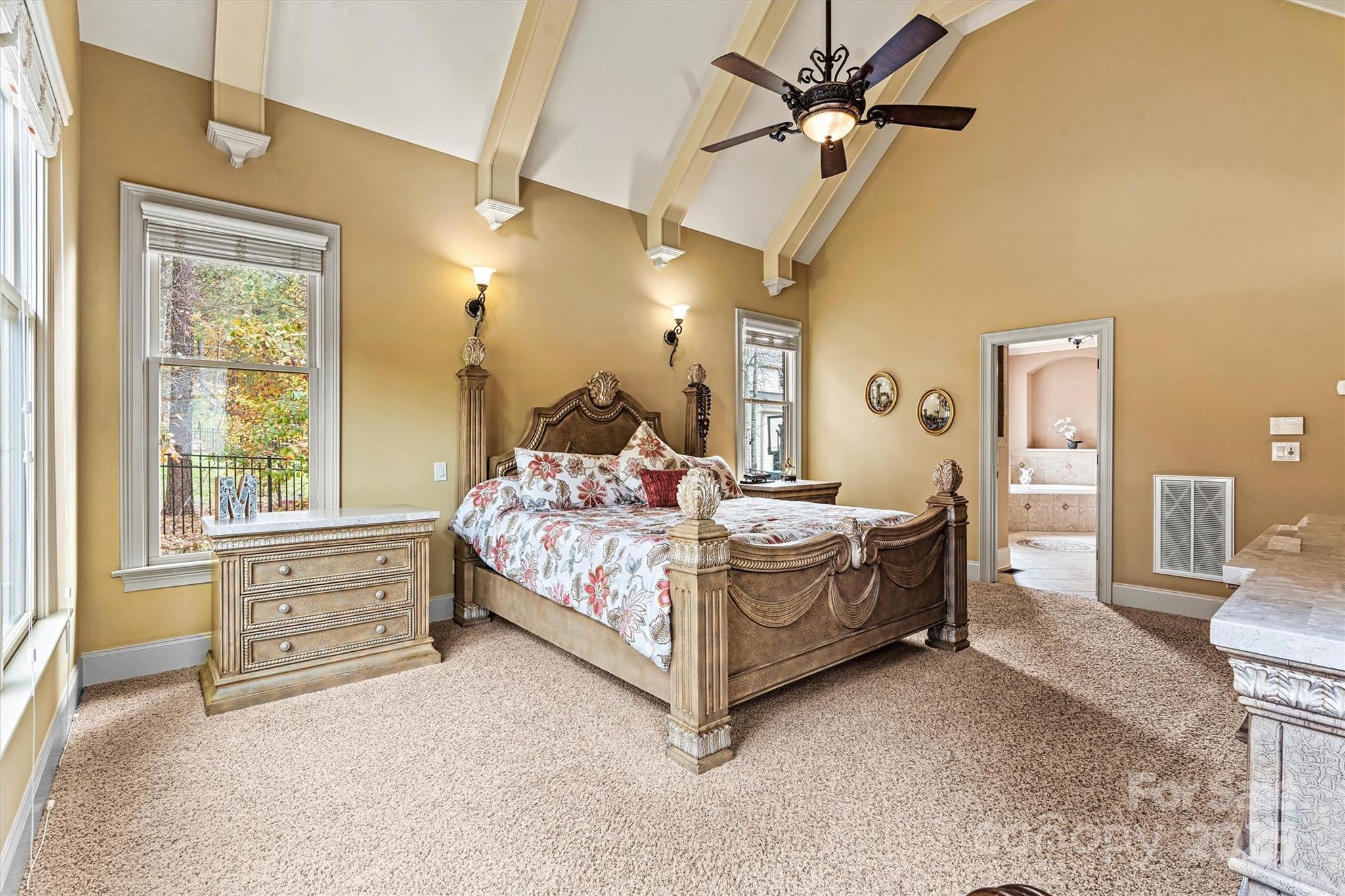 336 Kenway Loop Mooresville, NC 28117 - Photo 25 of 45 a bedroom with a bed and a chandelier