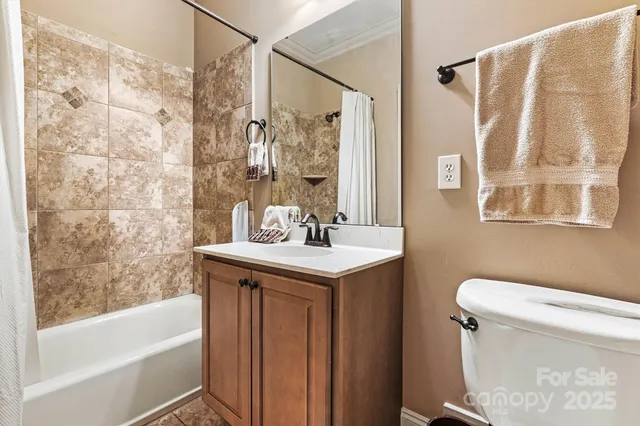 a bathroom with a sink a toilet and a bathtub