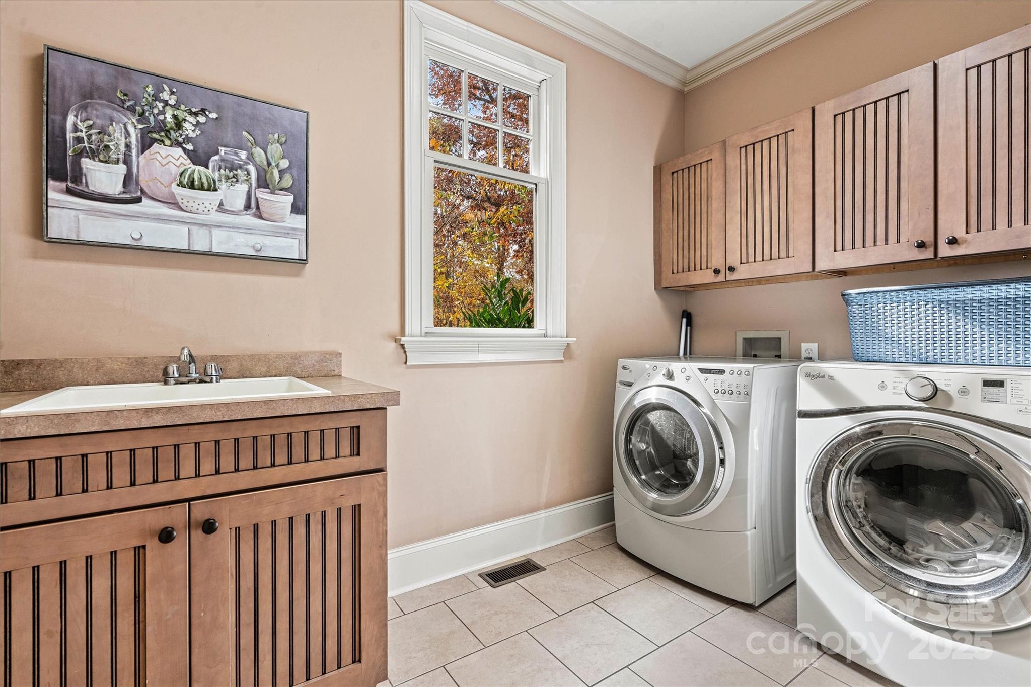 336 Kenway Loop Mooresville, NC 28117 - Photo 42 of 45 a utility room with cabinets dryer and washer