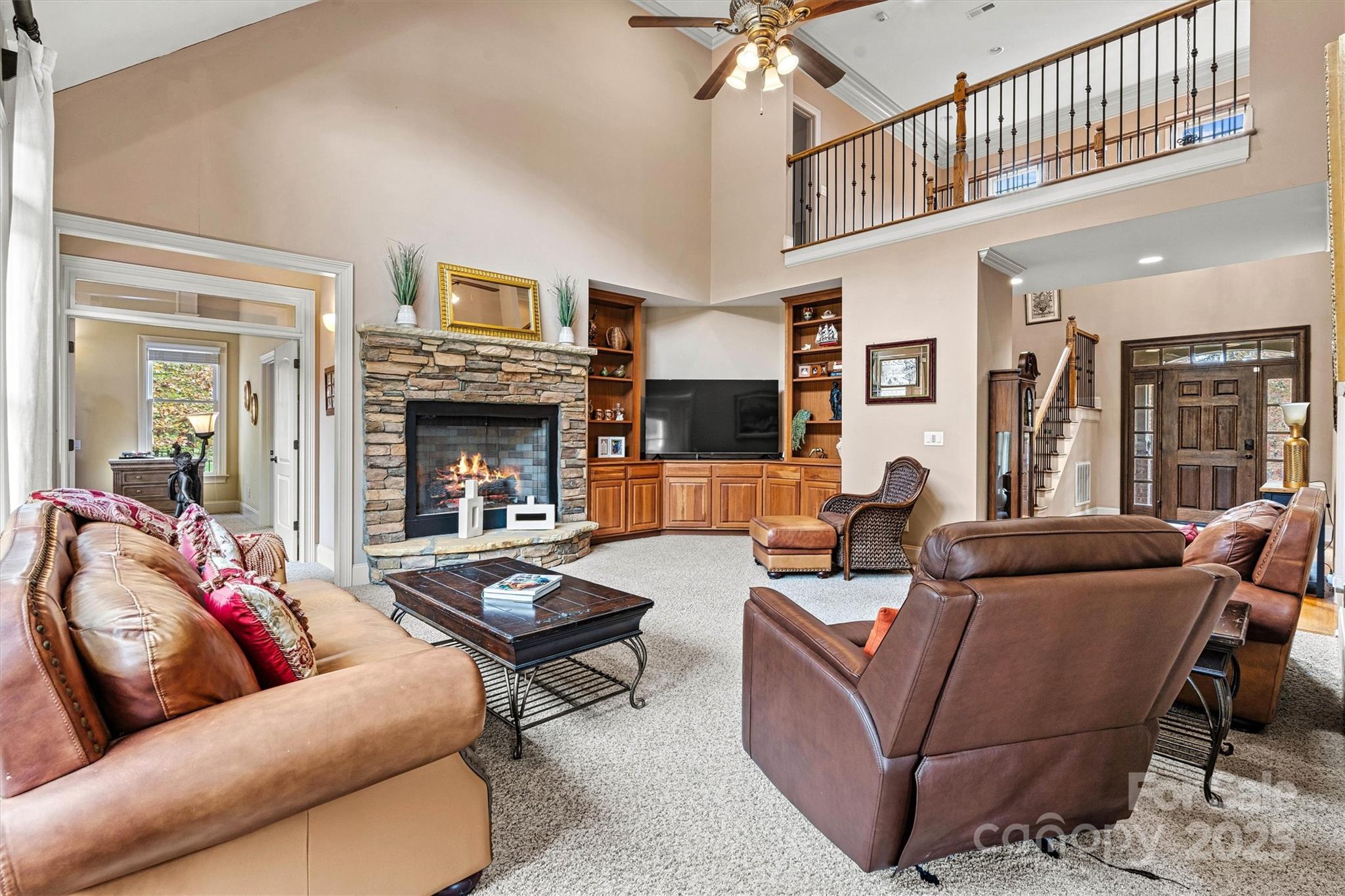 336 Kenway Loop Mooresville, NC 28117 - Photo 10 of 45 a living room with furniture fireplace and a chandelier