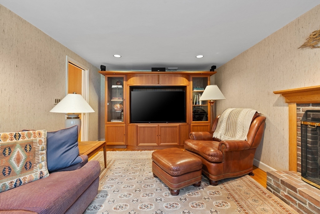 13 Townsend Road Lynnfield, MA 01940 - Photo 11 of 37 a living room with furniture and a flat screen tv