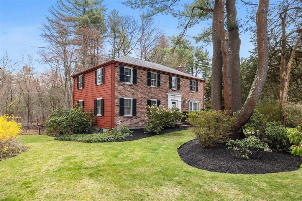13 Townsend Road Lynnfield, MA 01940 - Photo 36 of 37 a front view of a house with a yard