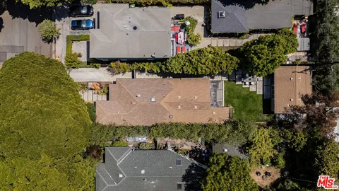 an aerial view of a house with a garden