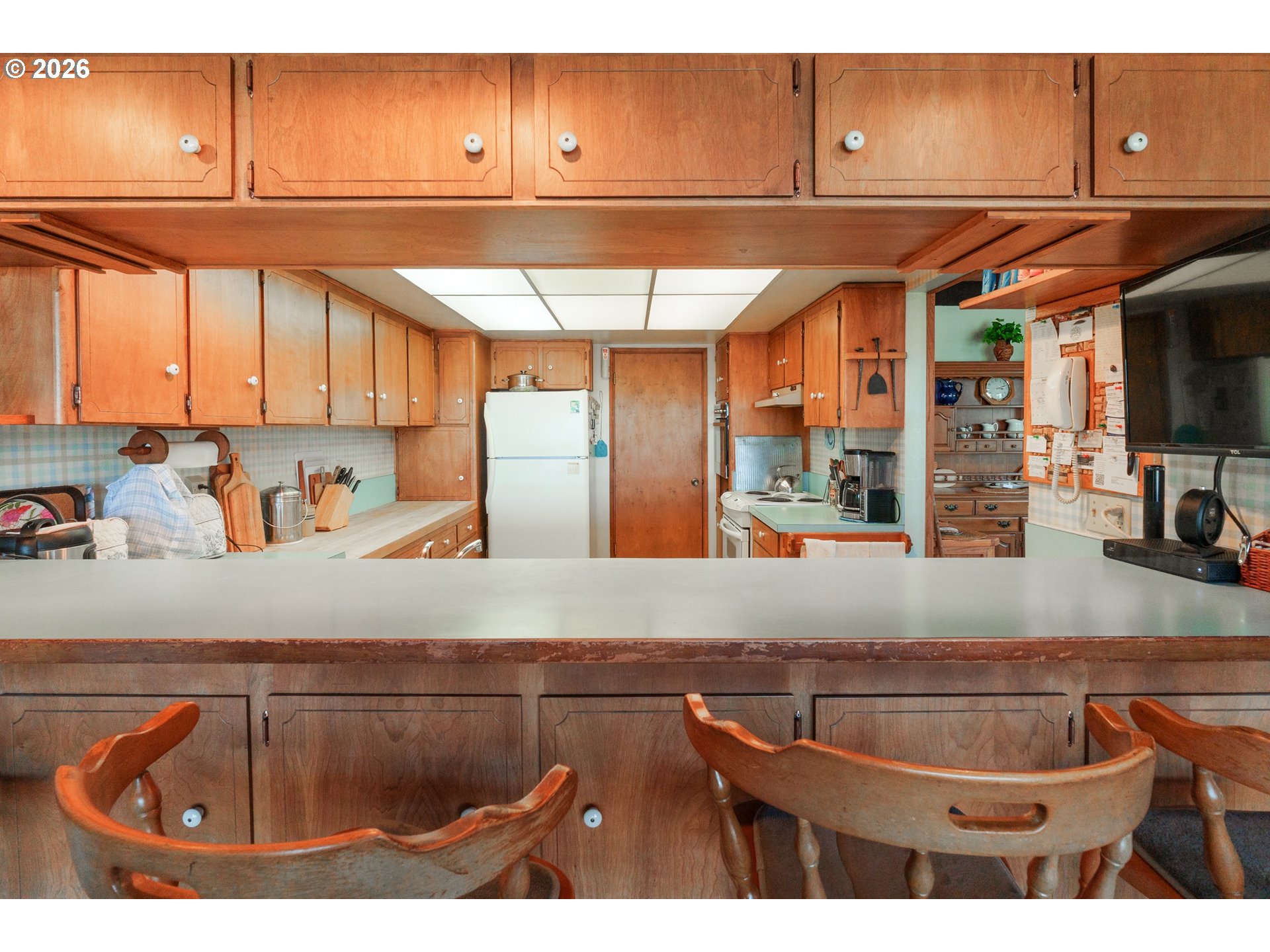 56358 Rusty Road Bandon, OR 97411 - Photo 14 of 41 a kitchen with a sink and cabinets