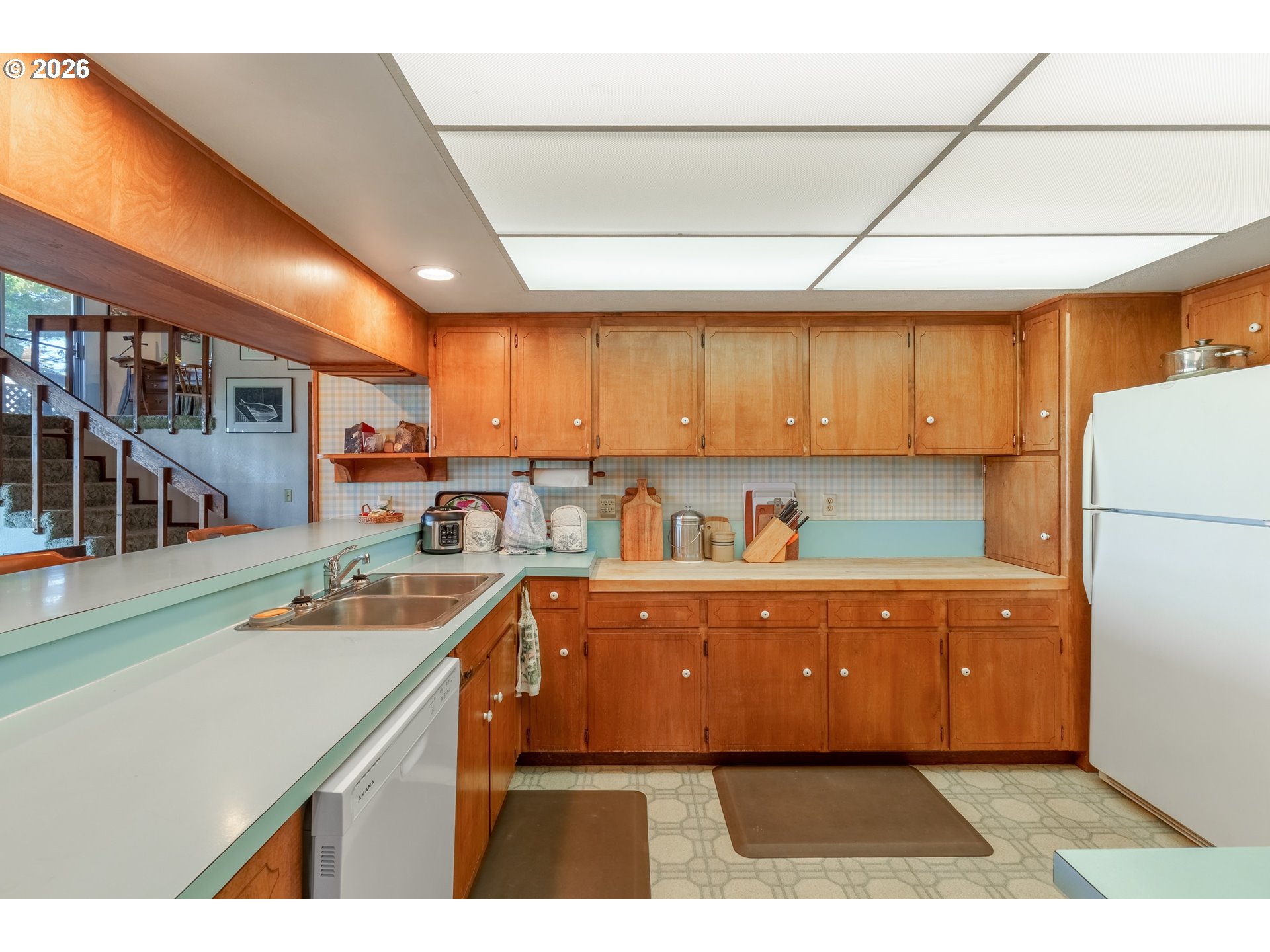 56358 Rusty Road Bandon, OR 97411 - Photo 15 of 41 a kitchen with cabinets and window