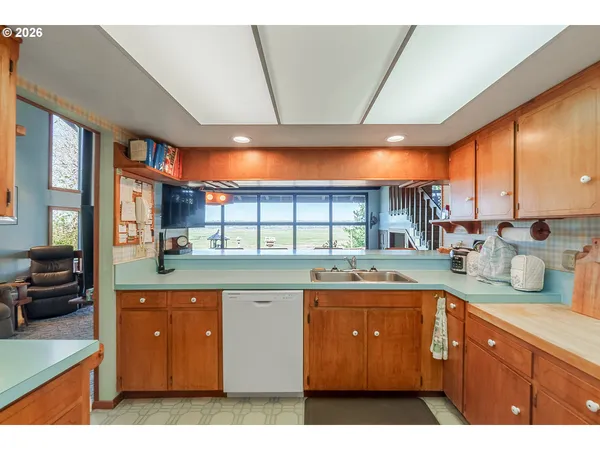 a kitchen with stainless steel appliances kitchen island granite countertop a sink and cabinets