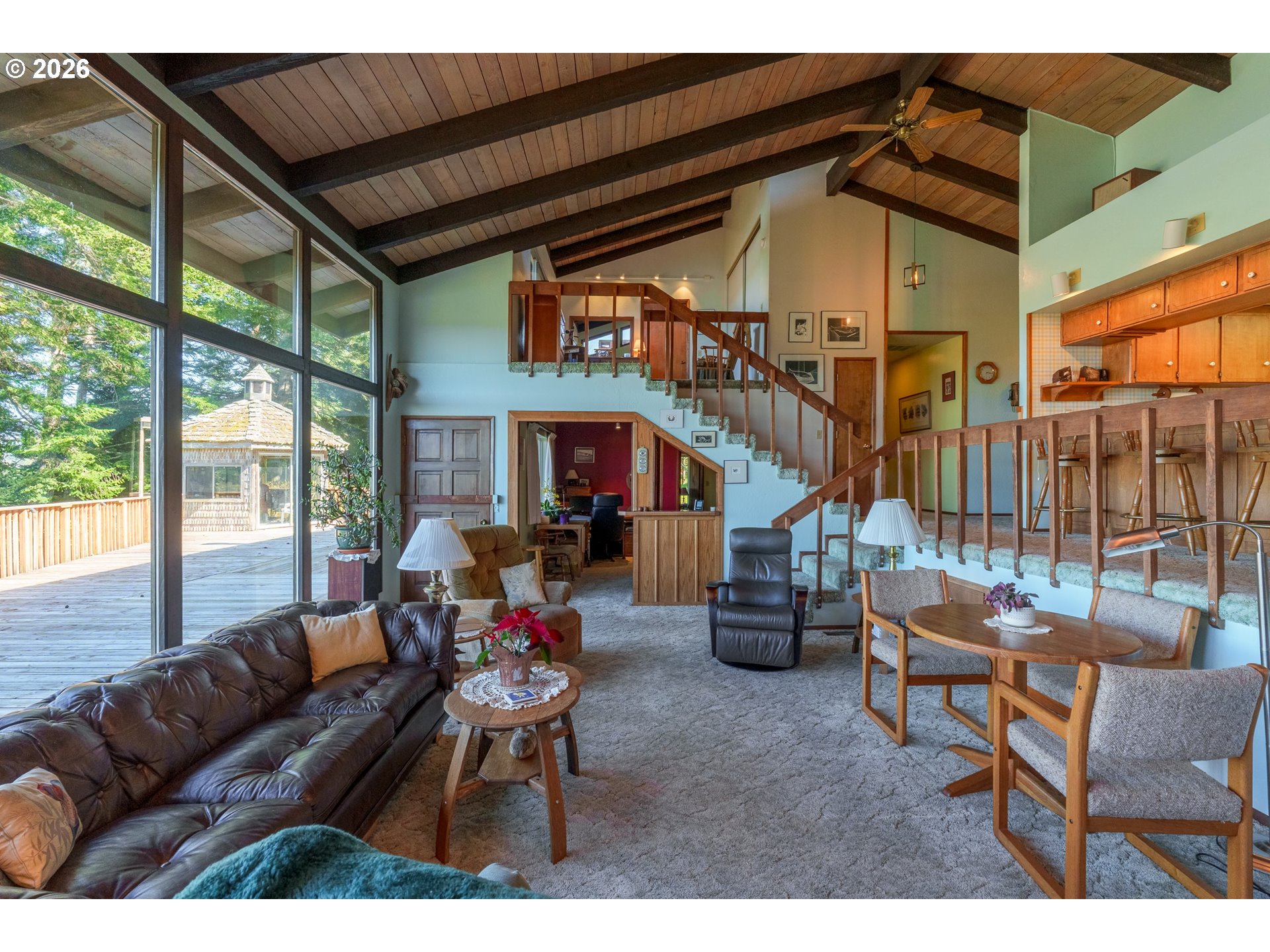 56358 Rusty Road Bandon, OR 97411 - Photo 21 of 41 a living room with furniture and a large window