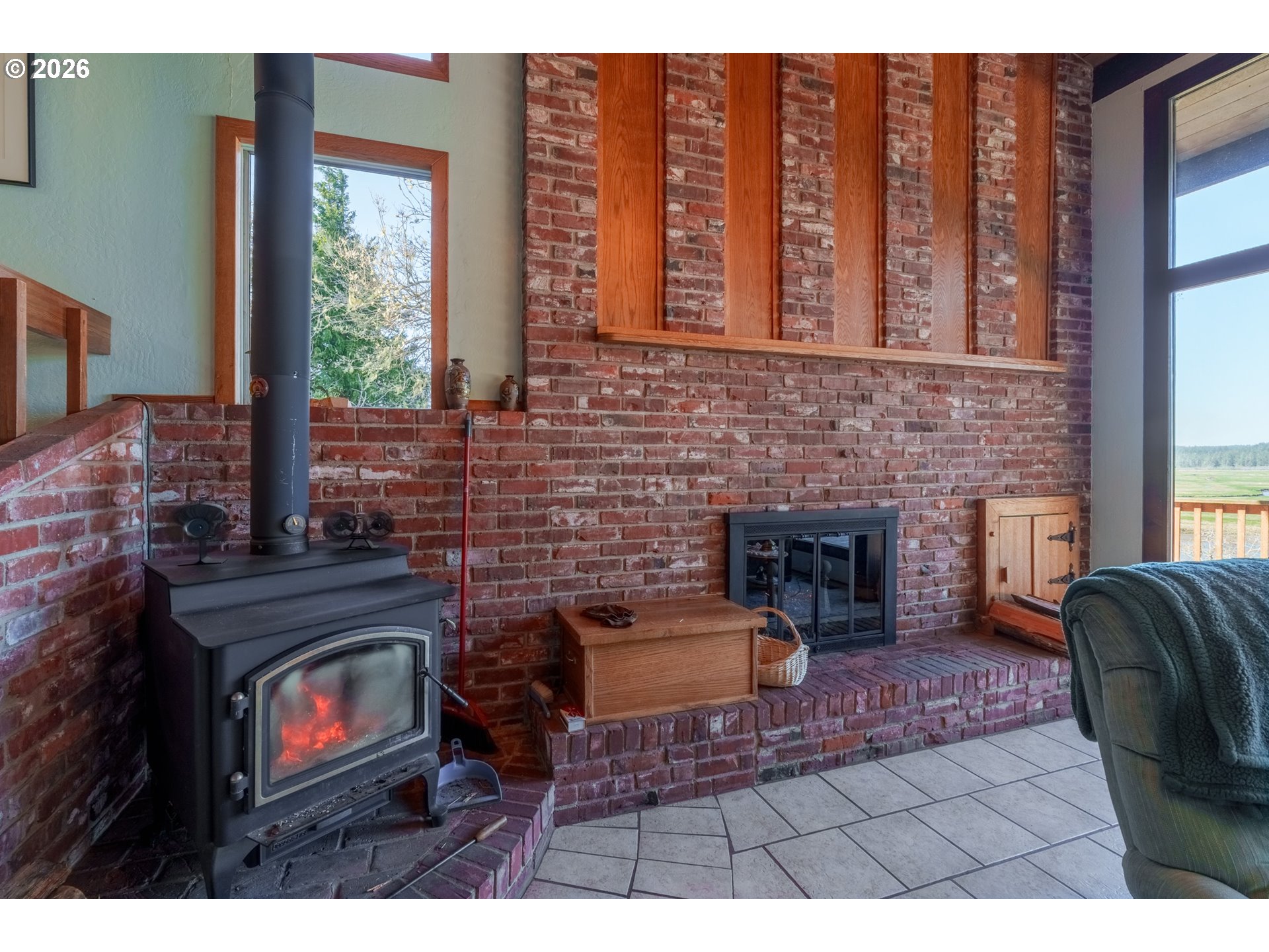 56358 Rusty Road Bandon, OR 97411 - Photo 23 of 41 a living room with furniture and a fireplace