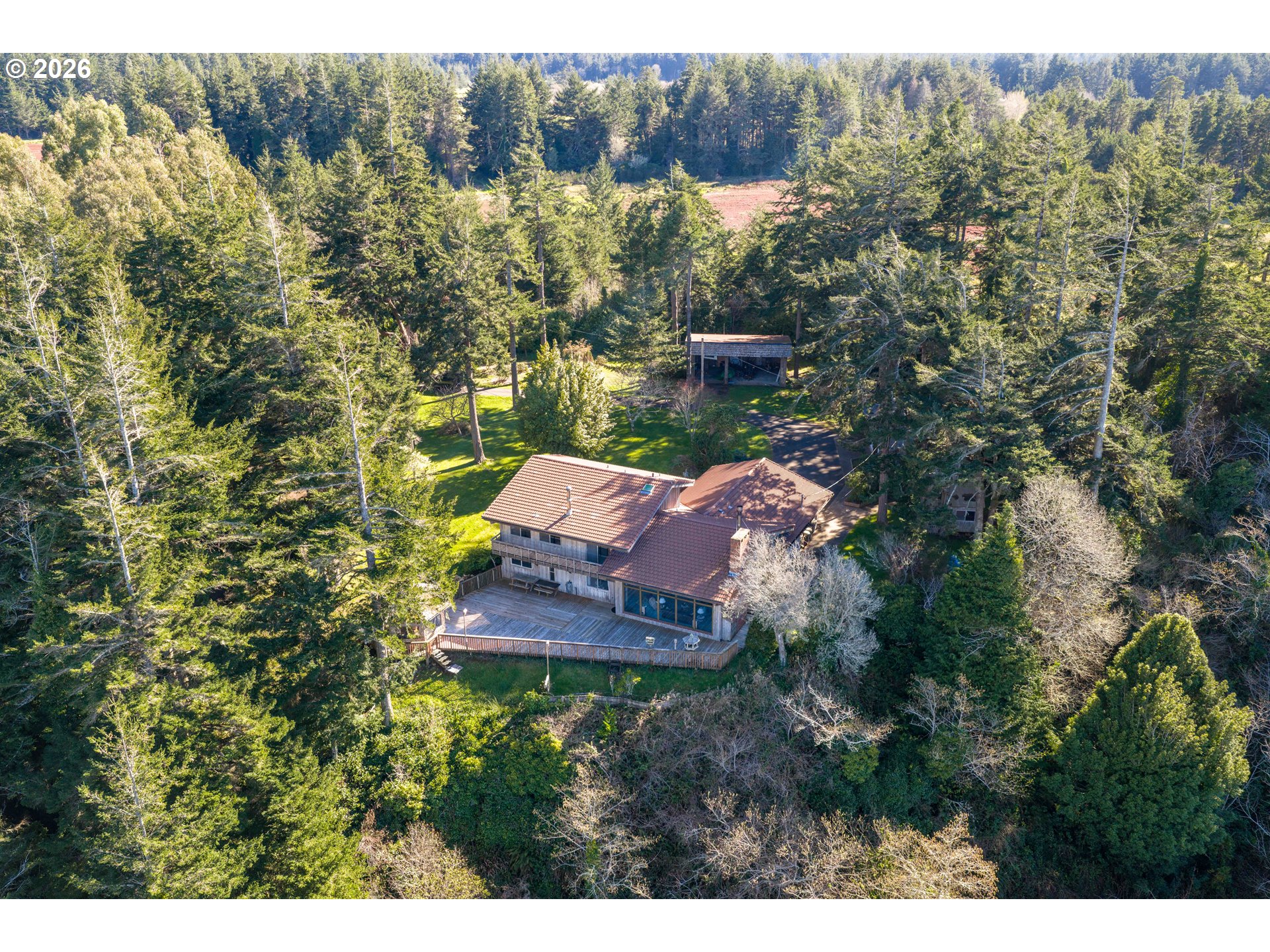 56358 Rusty Road Bandon, OR 97411 - Photo 40 of 41 a view of a house with a yard