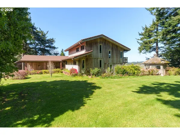 a front view of house with yard and green space