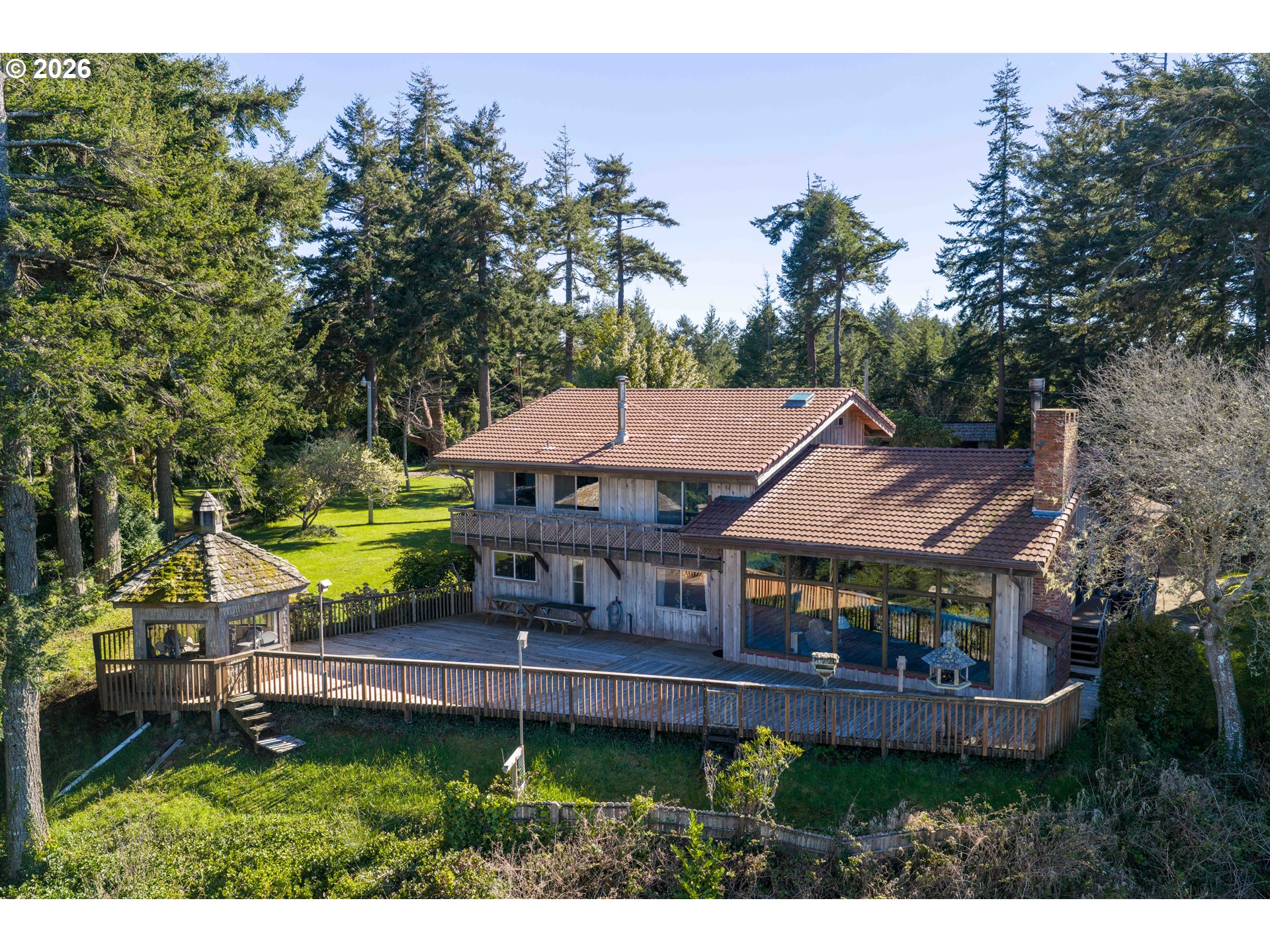 56358 Rusty Road Bandon, OR 97411 - Photo 7 of 41 a aerial view of a house with a garden