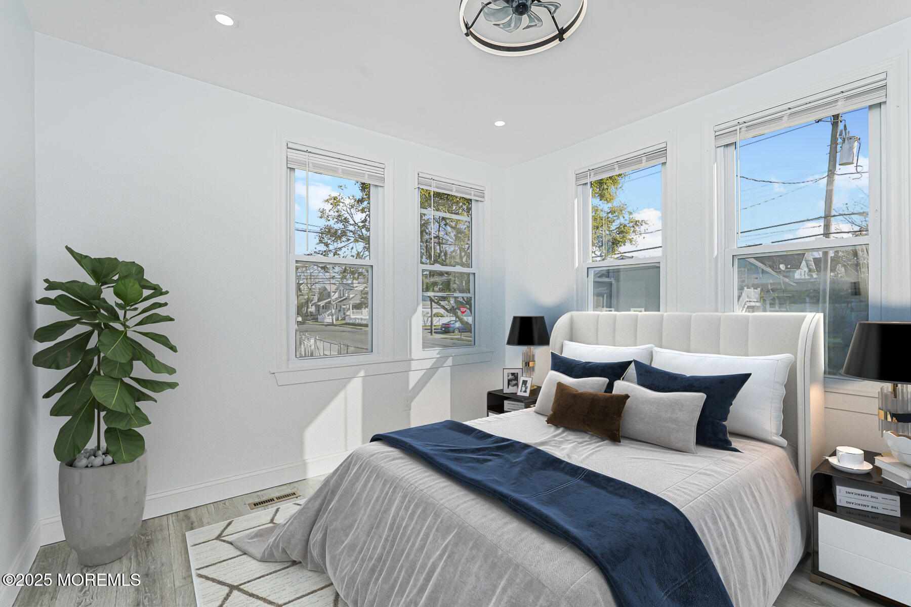 503 Ridge Avenue Neptune Township, NJ 07753 - Photo 14 of 17 a bed sitting in a bedroom next to a window