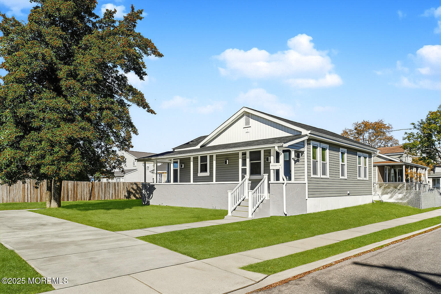 503 Ridge Avenue Neptune Township, NJ 07753 - Photo 2 of 17 a front view of a house with a yard and potted plants