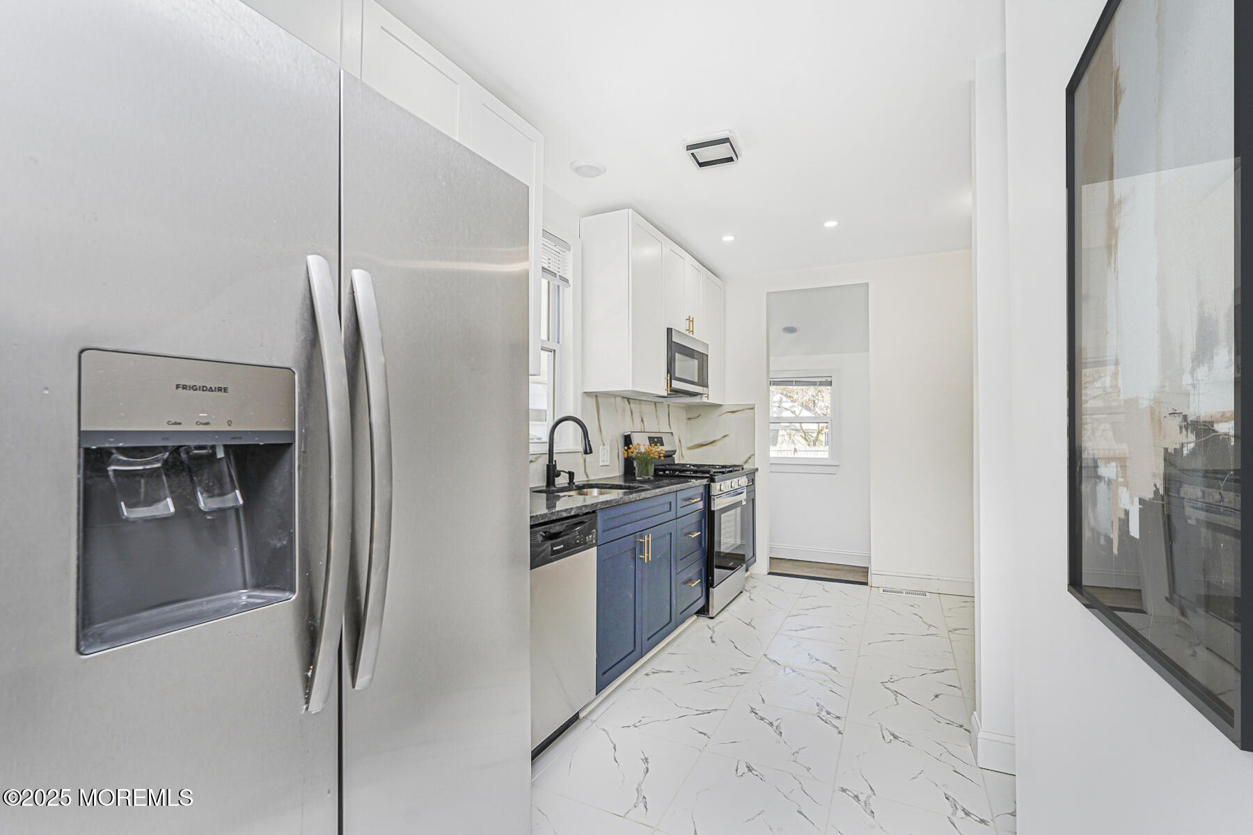 503 Ridge Avenue Neptune Township, NJ 07753 - Photo 9 of 17 a kitchen with stainless steel appliances granite countertop a refrigerator and a sink