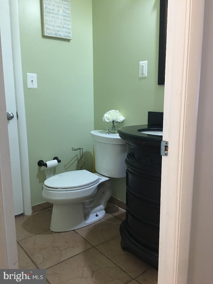 9817 Southall Road Randallstown, MD 21133 - Photo 25 of 32 cheerful half bath on main level