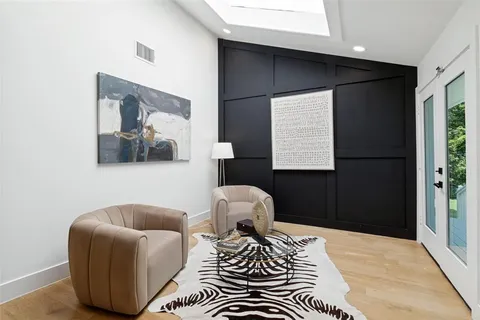 a bedroom with a bed and a couch