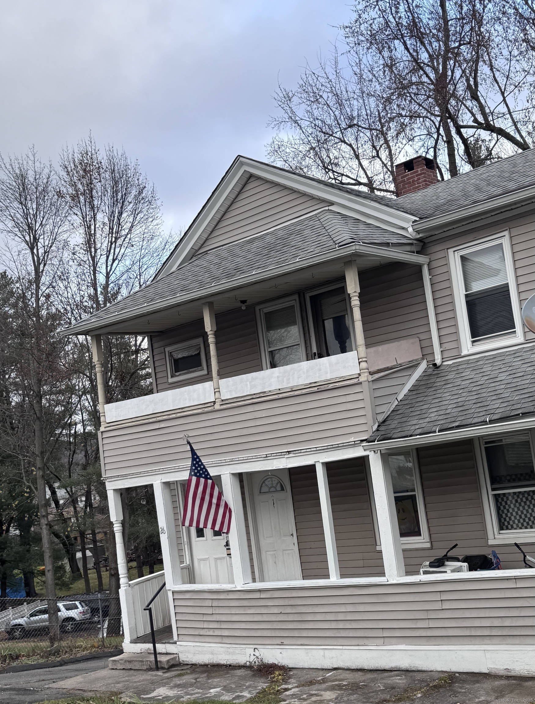 a view of a house with a roof deck