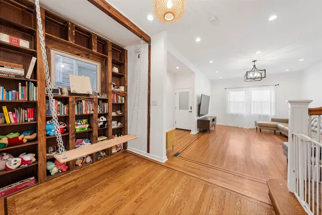a view of a living room and wooden floor