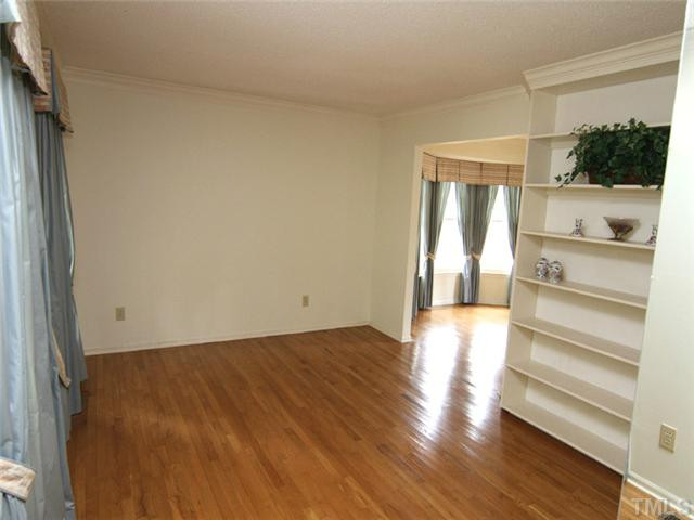 809 Carpenter Fletcher Road Durham, NC 27713 - Photo 5 of 14 Hardwood flooring accentuates most of the main floor, including the formal living room with built-in bookshelves. Living Room