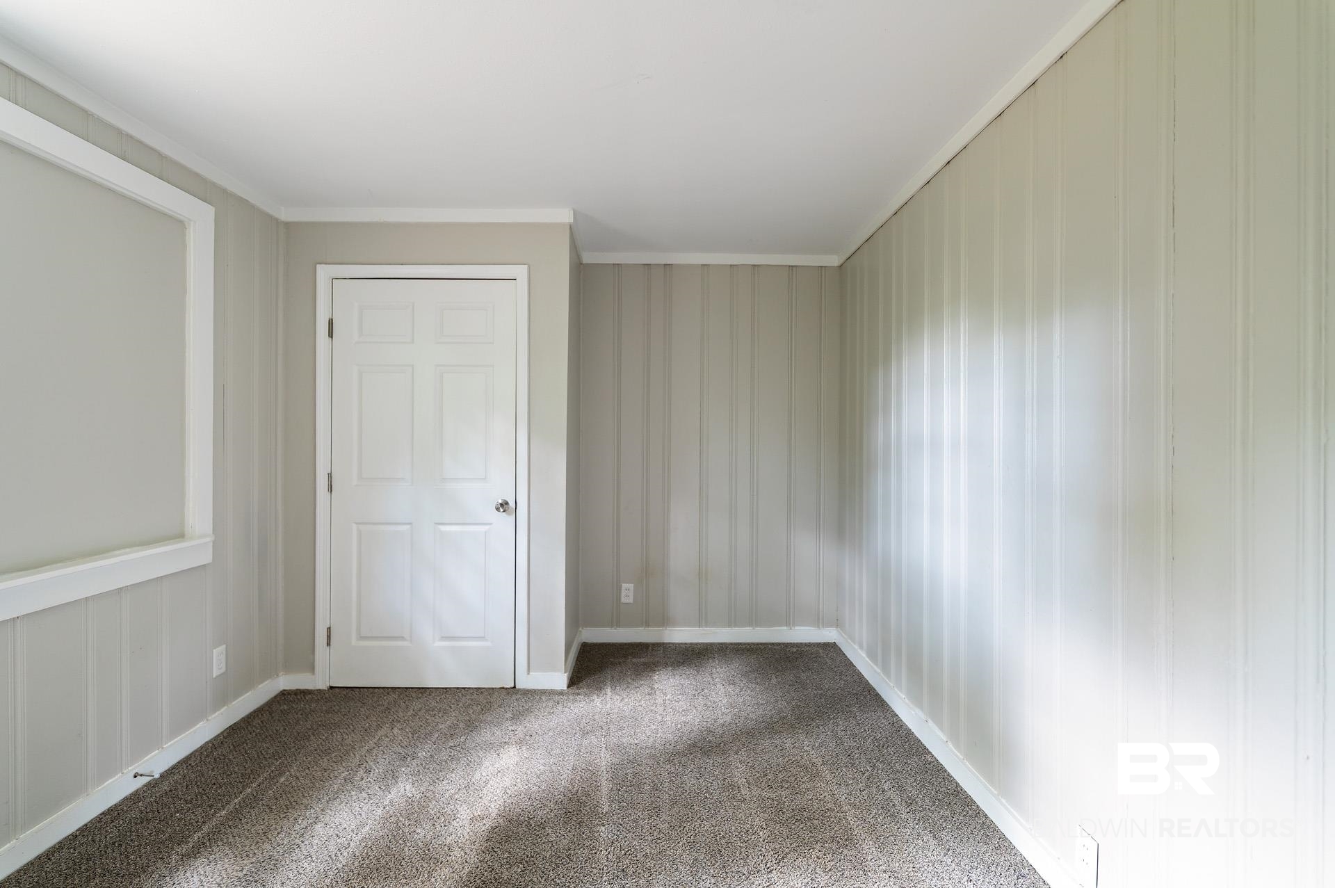 1869 Mott Drive West Mobile, AL 36617 - Photo 24 of 34 Unfurnished bedroom with baseboards, crown molding, and carpet