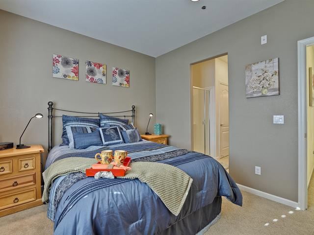 247 Peppermint Tree Terrace, Unit 3 Sunnyvale, CA 94086 - Photo 13 of 25 a bedroom with bed and paintings on the wall