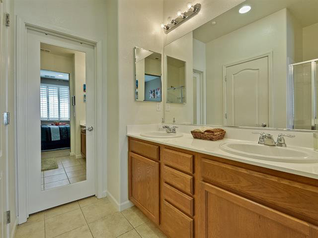 247 Peppermint Tree Terrace, Unit 3 Sunnyvale, CA 94086 - Photo 14 of 25 a bathroom with a sink and a mirror