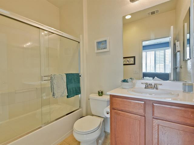 247 Peppermint Tree Terrace, Unit 3 Sunnyvale, CA 94086 - Photo 17 of 25 a bathroom with a granite countertop sink toilet and shower